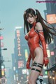 A woman in a red latex outfit standing in the middle of a city.